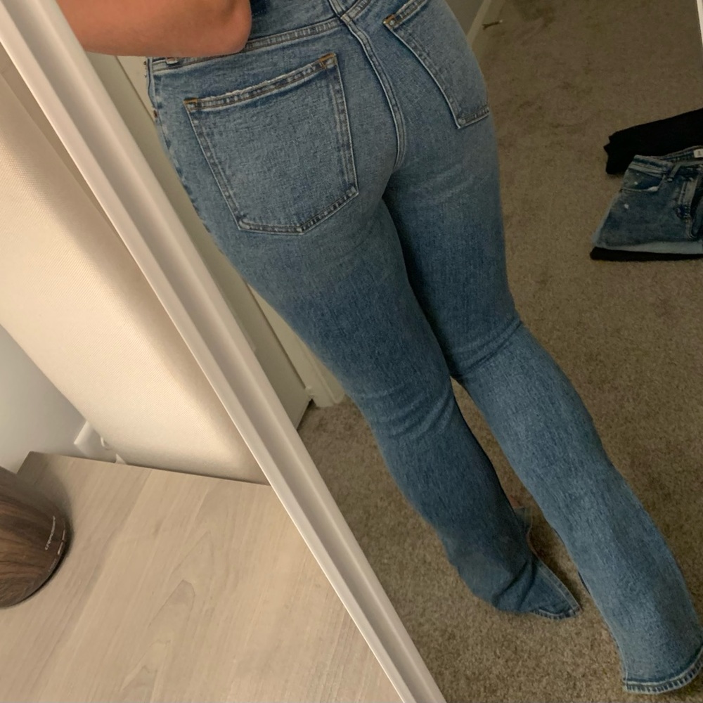 Abercrombie & Fitch slit hem high rise slim jean in modern indigo wash.